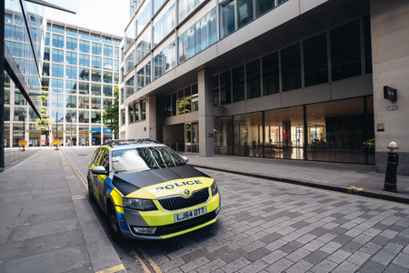 London / UK - 07/11/2020: Police car parked on empty street next to One New Change shopping mall...