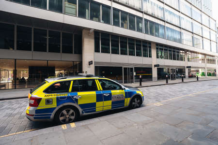 London / UK - 07/11/2020: Police car parked on empty street next to One New Change shopping mall next to St. Paul Cathedralのeditorial素材