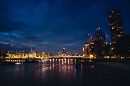 London / UK -  2020.07.18: Late evening view of the City business area of the capital over the river Thamesのeditorial素材