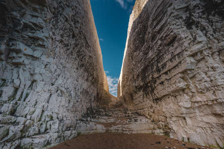 Broadstairs, Kent / UK -  2020.08.01: Empty Kingsgate Beach, walking through the chalk stacks clifs at Botany Bay in Kent, England.の写真素材
