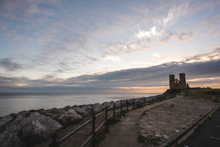 Reculver / UK -  2020.08.01: Remains of Reculver church towers at early october sunrise  early...