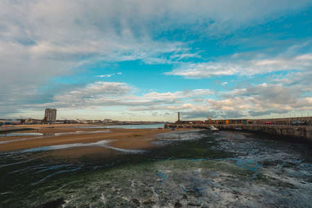Margate / UK -  2020.08.01: English seaside view of beach and promenade, Kent, England, United Kingdom on early blue sky morning.のeditorial素材