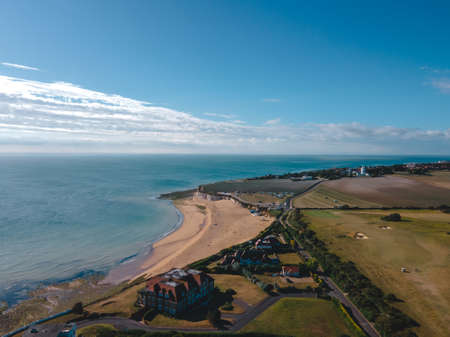 Drone aerial shot of Empty Kingsgate Beach and Castle on the cliffs above the Bay, on cloudy autumn morning.の写真素材