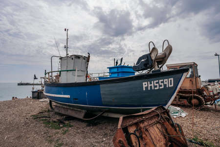Hastings Port, East Sussex / UK -  2020.08.08: Hastings fishing boats on the beach at Rock-a-Noreの写真素材