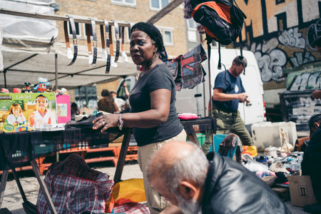 Brick Lane, East London / UK -  2020.08.16: People buying and selling different items stuff at at Vintage Marketのeditorial素材