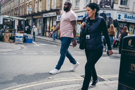 Brick Lane, East London / UK -  2020.08.16: People walking around area looking at different items stuff at Vintage Marketのeditorial素材