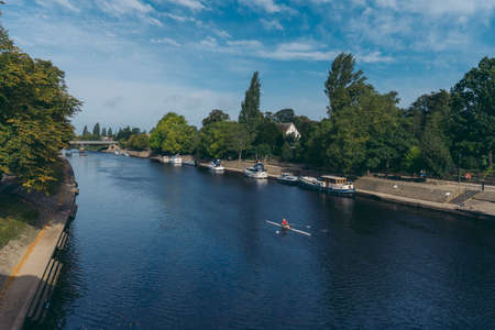 York, North Yorkshire | UK -  2020.09.11: Rowers on the river Ouse on sunny weekend morningのeditorial素材