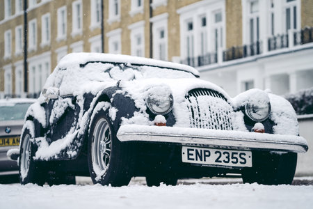 Richmond Upon Thames, London | UK -  2021.01.24: Vintage Classic Morgan Covered in snow on cold winter morningのeditorial素材