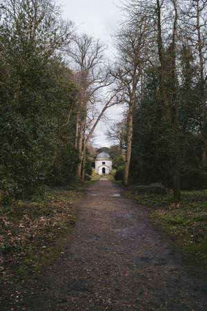Chiswick, West London | UK -  2021.03.14: Ancient Ionic Temple and Obelisk at beautiful gardens in Burlington Lane, Borough of Hounslow, England.のeditorial素材