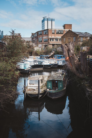 Brentford, West London | UK -  2021.03.21: Boats moored at the beginning of the Grand Union Canalのeditorial素材