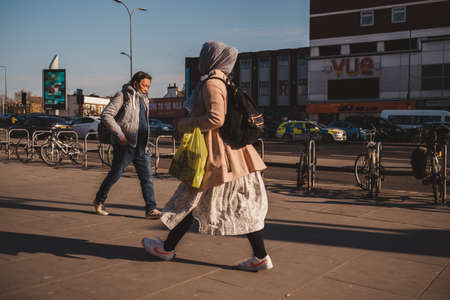 Shepherd's Bush, London | UK -  2021.03.22: People walking the streets of oddgy area on sunny spring eveningのeditorial素材