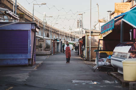 Shepherd's Bush, London | UK -  2021.03.22: People walking around the closed Shepherd's Bush Market during the Coronavirus Pandemic Lockdownのeditorial素材