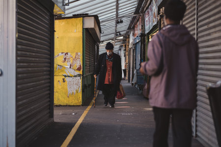 Shepherd's Bush, London | UK -  2021.03.22: People walking around the closed Shepherd's Bush Market during the Pandemic Lockdownのeditorial素材