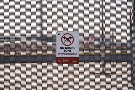 Heathrow Airport, London | UK -  2021.03.27: No flying drone sign on the fence of Heathrow Airport