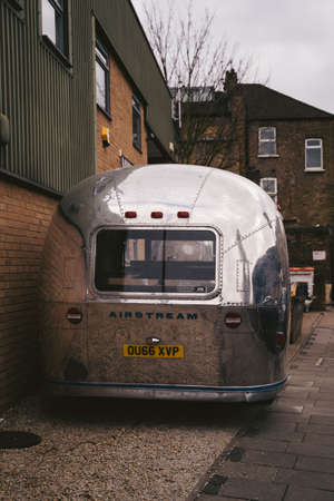 Wandsworth Town, London | UK -  2021.04.03: Shiny Airstream Style Caravan, Trailer Parked on the sidewalkのeditorial素材