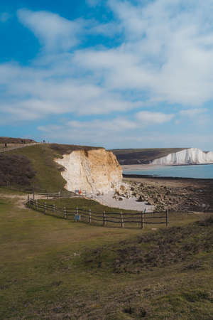 Seaford, East Sussex | UK -  2021.04.04: Seaford Head Nature Reserve View on cloudy morning from the top of the Chalk Cliffs walk. Seven Sisters, South of Englandの写真素材
