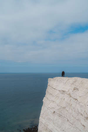 Seaford, East Sussex | UK -  2021.04.04: People walking the paths on the top of the Chalk Cliffs. Seven Sisters, South of Englandのeditorial素材
