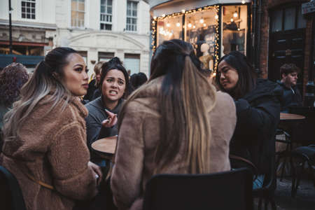 Soho, London | UK -  2021.04.16: People sitting in pubs and restaurants on Friday evening after ending of Coronavirus Lockdownのeditorial素材