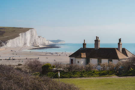 East Sussex | UK -  2021.04.04: Tiny House at the edge of the Chalk Cliffs at Seaford Head Nature Reserve,  Cuckmere Haven beach. Seven Sisters, South of Englandのeditorial素材