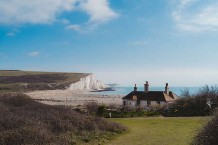 East Sussex | UK -  2021.04.04: Tiny House at the edge of the Chalk Cliffs at Seaford Head Nature Reserve,  Cuckmere Haven beach. Seven Sisters, South of Englandのeditorial素材