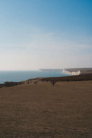 East Sussex | UK -  2021.04.04: Seven Sisters, Clifftop Paths Nature Reserve View of the Chalk Cliffs and the English Channel sea from the edge. South of Englandのeditorial素材