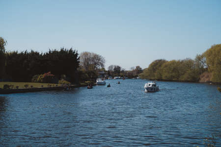 Staines-upon-Thames, Spelthorne
 | UK -  2021.04.24: Boats on the river THames in Staines on sunny Spring dayのeditorial素材