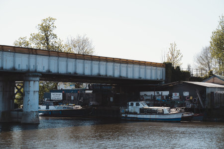Staines-upon-Thames, Spelthorne | UK -  2021.04.24: Boats moored under the Railway bridge