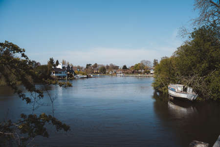 Staines-upon-Thames, Spelthorne | UK -  2021.04.24: Old boat abandoned and moored on the Thames River in Stainesのeditorial素材