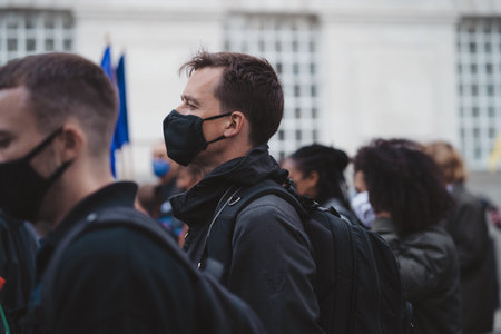 Westminster, London | UK -  2021.05.01: People wearing masks and waving flags and banners at Kill...