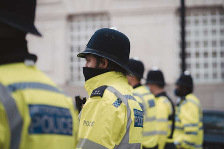 Westminster, London | UK -  2021.05.01: Police officers wearing masks  at "Kill the Bill" protest.のeditorial素材
