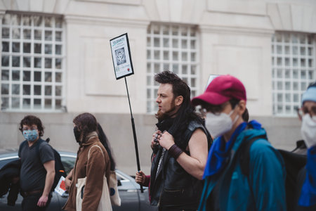 Westminster, London | UK -  2021.05.01: People wearing masks and waving flags and banners at Kill...