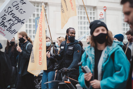 Westminster, London | UK -  2021.05.01: People wearing masks and waving flags and banners at Kill...