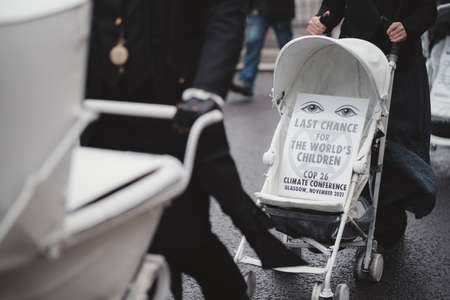 Westminster, London | UK -  2021.05.08: Extinction Rebellion activists marching slowly towards Downing Street with White Baby Pramsのeditorial素材