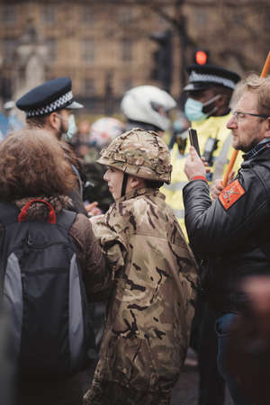 Westminster, London | UK -  2021.05.08: Young boy in military uniform at London march to support veterans.のeditorial素材