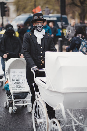 Westminster, London | UK -  2021.05.08: Extinction Rebellion activists marching slowly towards...