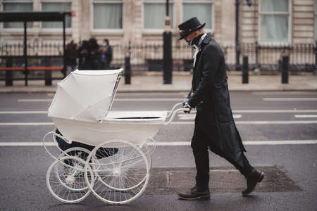 Westminster, London | UK -  2021.05.08: Extinction Rebellion activists marching slowly towards Downing Street with White Baby Pramsのeditorial素材