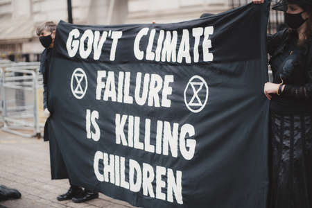 Westminster, London | UK -  2021.05.08: Extinction Rebellion activists marching slowly towards Downing Street with White Baby Pramsのeditorial素材