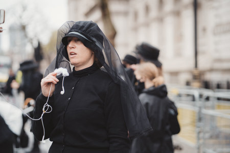 Westminster, London | UK -  2021.05.08: Extinction Rebellion activists marching next to Downing Street with White Baby Prams in front of Police officersのeditorial素材