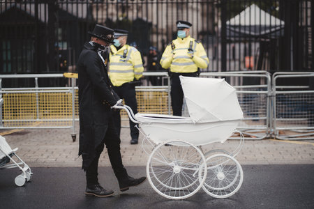 Westminster, London | UK -  2021.05.08: Extinction Rebellion activists marching next to Downing...