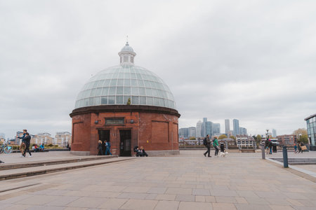Greenwich, London | UK -  2021.05.08: The view of Greenwich foot tunnel entrance with Canary Wharf...