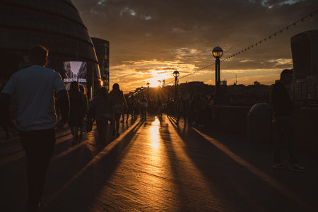 Thames River Embankment, London | UK - 2021.06.26: The view of the embankment and City Hall from the Tower Bridge with a beautiful sunset in the backgroundのeditorial素材