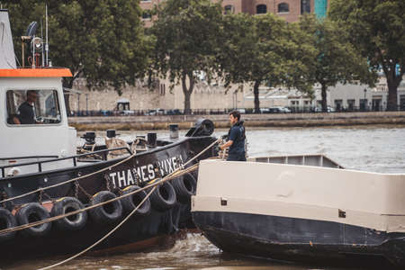 Thames River Embankment, London | UK - 2021.06.26: Tugboat team at the Thames Riverのeditorial素材