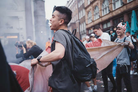 London | UK - 2021.07.12: English fans waving flags at Leicester Square before the final Euro 2020 Football gameのeditorial素材