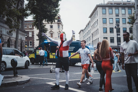 London | UK - 2021.07.12: English fans with flags gathering at Leicester Square to watch the Final Euro 2020 Football gameのeditorial素材