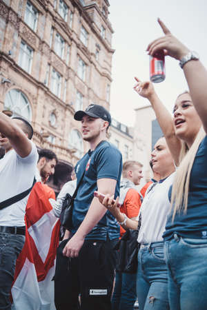 London | UK - 2021.07.12: English fans with flags gathering at Leicester Square to watch the Final Euro 2020 Football gameのeditorial素材