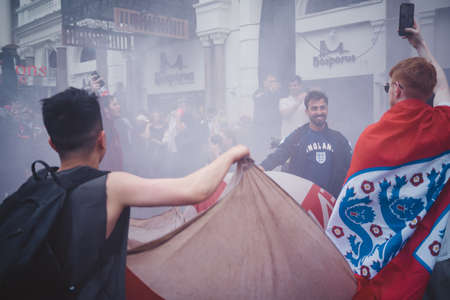 London | UK - 2021.07.12: English fans waving flags at Leicester Square before the final Euro 2020 Football gameのeditorial素材