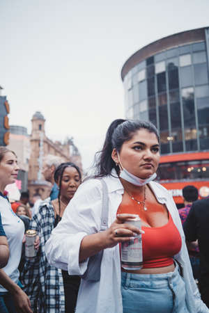 London | UK - 2021.07.12: English fans with beer and flags gathering at Leicester Square to watch the Final Euro 2020 Football gameのeditorial素材