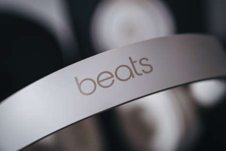 London | UK - 2021.10.09: Close up product photos of ivory Beats Solo Pro wireless bluetooth on-ear headphones with active noise cancelling on black deskのeditorial素材