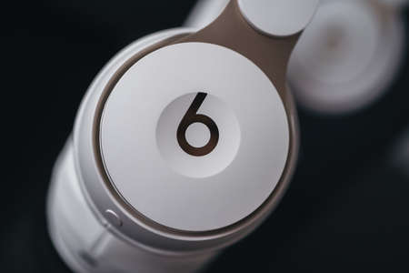 London | UK - 2021.10.09: Close up product photos of ivory Beats Solo Pro wireless bluetooth on-ear headphones with active noise cancelling on black deskのeditorial素材