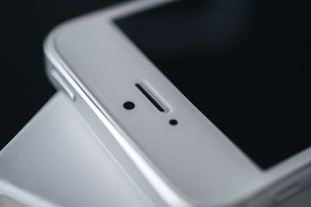 London | UK - 2021.10.09: Close up product photos of Iphone SE in silver color sealed in plastic on boxのeditorial素材